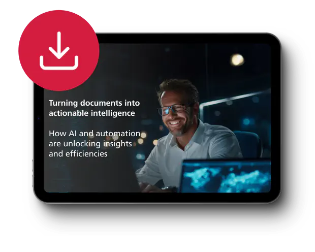 A man smiles at a computer screen in a dimly lit office, conveying a sense of achievement. Text reads: "Turning documents into actionable intelligence. How AI and automation are unlocking insights and efficiencies." A red download icon is in the top left.